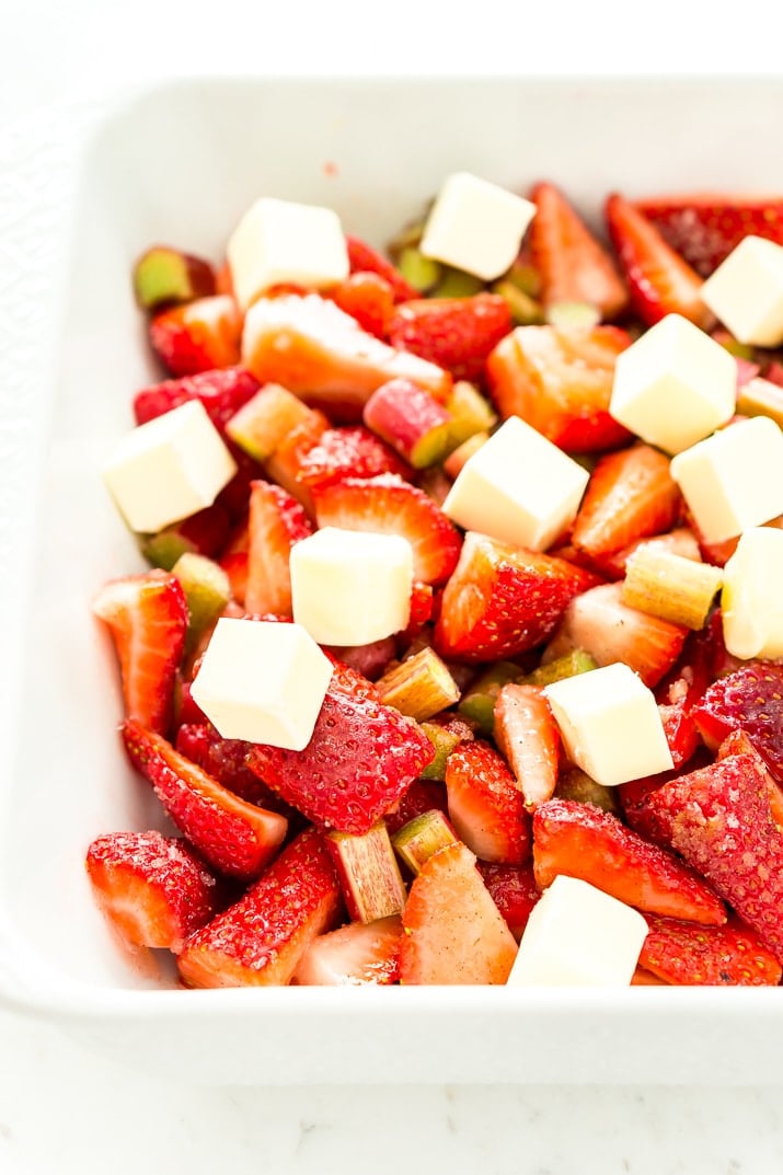 This Strawberry Rhubarb Crisp is an old-fashioned, simple, sweet, and tart summer dessert with a deliciously buttery and crispy crumble topping made from oatmeal and brown sugar.