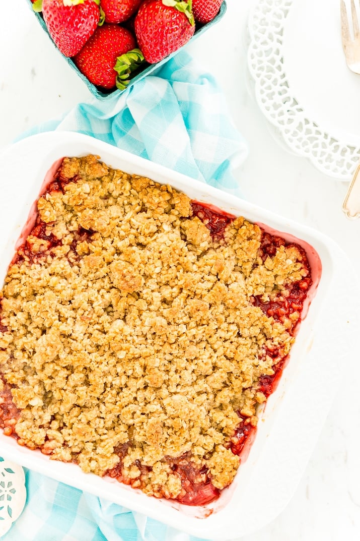 This Strawberry Rhubarb Crisp is an old-fashioned, simple, sweet, and tart summer dessert with a deliciously buttery and crispy crumble topping made from oatmeal and brown sugar.