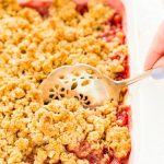 This Strawberry Rhubarb Crisp is an old-fashioned, simple, sweet, and tart summer dessert with a deliciously buttery and crispy crumble topping made from oatmeal and brown sugar.