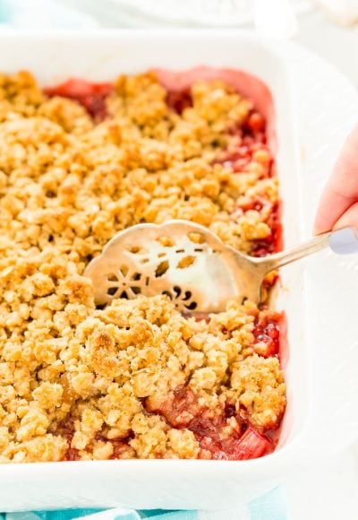 This Strawberry Rhubarb Crisp is an old-fashioned, simple, sweet, and tart summer dessert with a deliciously buttery and crispy crumble topping made from oatmeal and brown sugar.