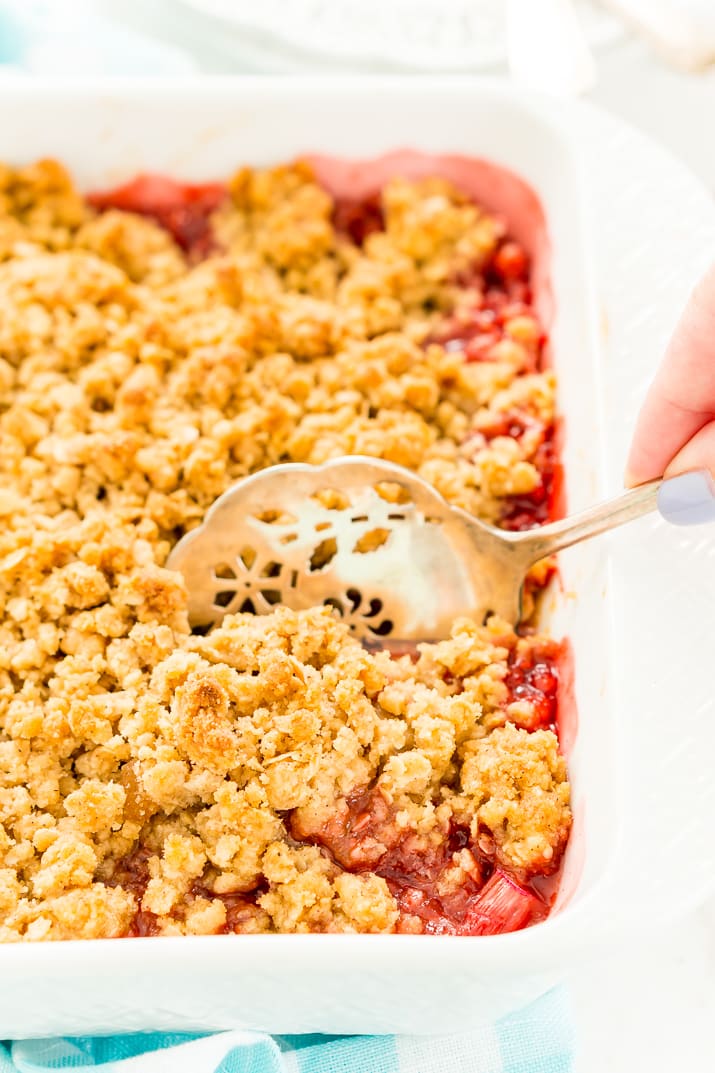 This Strawberry Rhubarb Crisp is an old-fashioned, simple, sweet, and tart summer dessert with a deliciously buttery and crispy crumble topping made from oatmeal and brown sugar.