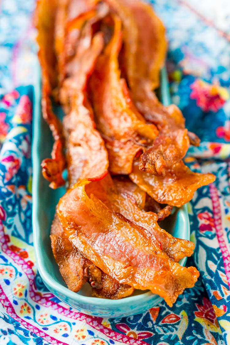 Baking Bacon in the oven is an easy method for cooking perfect bacon, the best part is, no mess! Enjoy the bacon immediately or save for other recipes!