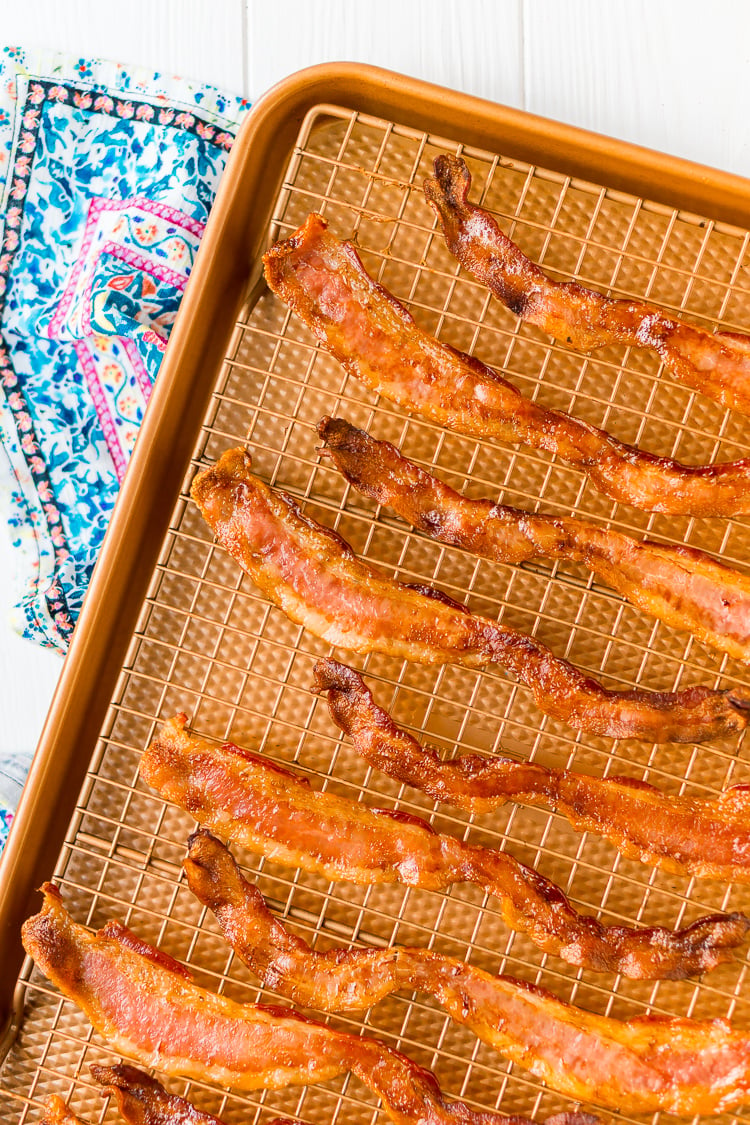 Baking Bacon in the oven is an easy method for cooking perfect bacon, the best part is, no mess! Enjoy the bacon immediately or save for other recipes!