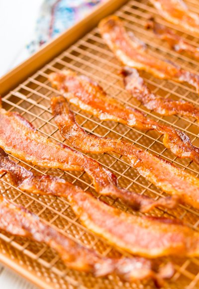 Baking Bacon in the oven is an easy method for cooking perfect bacon, the best part is, no mess! Enjoy the bacon immediately or save for other recipes!