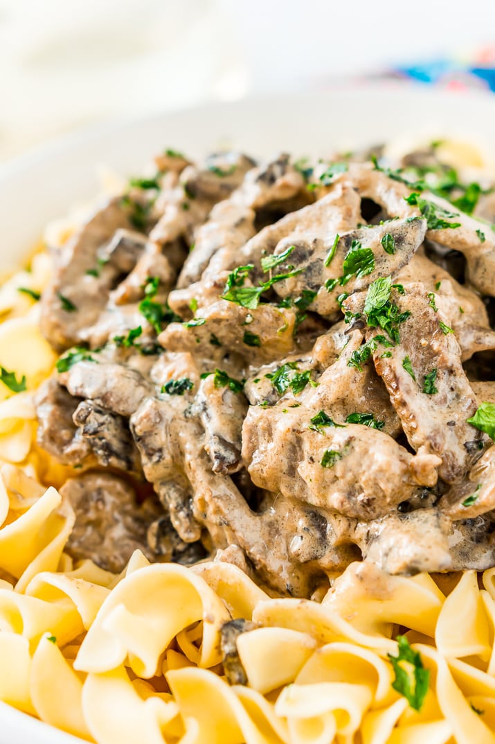 Beef Stroganoff is a delicious dinner recipe made with tender ribeye steak sautéed in a buttery mushroom and sour cream sauce and served over egg noodles.