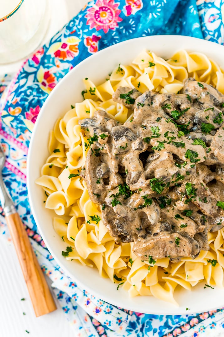 Beef Stroganoff is a delicious dinner recipe made with tender ribeye steak sautéed in a buttery mushroom and sour cream sauce and served over egg noodles.