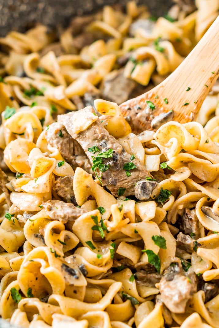 Beef Stroganoff is a delicious dinner recipe made with tender ribeye steak sautéed in a buttery mushroom and sour cream sauce and served over egg noodles.