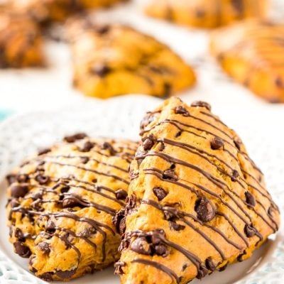Pumpkin Scones are the sophisticated way to enjoy pumpkin and spice this season! This simple recipe calls for dark and semi-sweet chocolate chips so you can indulge your chocolate cravings and get your pumpkin fix morning, noon, or night.