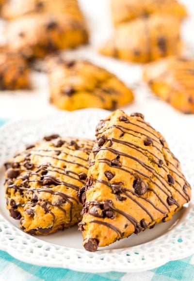 Pumpkin Scones are the sophisticated way to enjoy pumpkin and spice this season! This simple recipe calls for dark and semi-sweet chocolate chips so you can indulge your chocolate cravings and get your pumpkin fix morning, noon, or night.