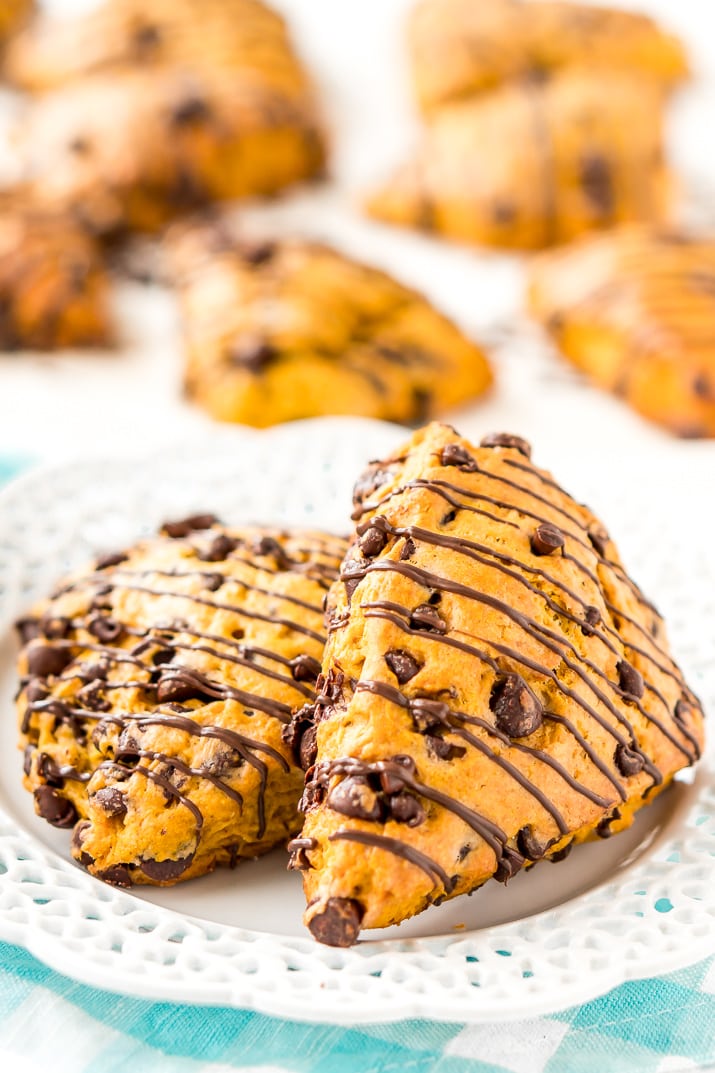 Pumpkin Scones are the sophisticated way to enjoy pumpkin and spice this season! This simple recipe calls for dark and semi-sweet chocolate chips so you can indulge your chocolate cravings and get your pumpkin fix morning, noon, or night.