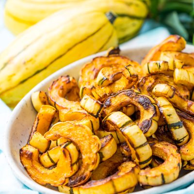 Delicata Squash is a small, easy to cook squash that's sweet and tender and doesn't require peeling because you can eat the skin! Roast it with salt, pepper, and olive oil or cinnamon, brown sugar, and coconut oil for an even sweeter side dish!