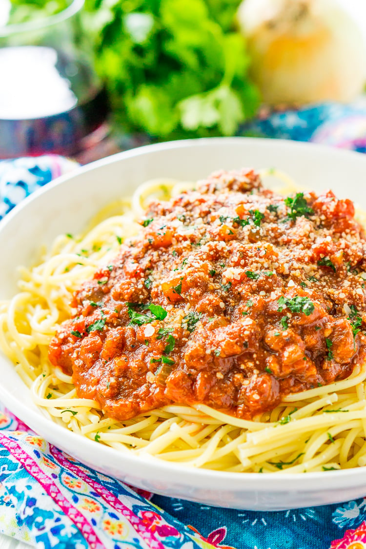 This Easy Spaghetti Bolognese Sauce Recipe is a simple take on an authentic and traditional Italian meal. Loaded with ground beef and spices and laced with Merlot wine, this quick tomato based sauce is bound to be a wholesome family favorite.