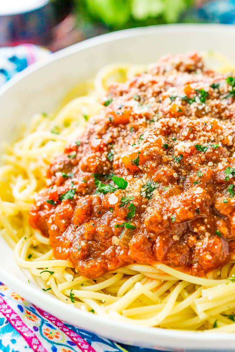 This Easy Spaghetti Bolognese Sauce Recipe is a simple take on an authentic and traditional Italian meal. Loaded with ground beef and spices and laced with Merlot wine, this quick tomato based sauce is bound to be a wholesome family favorite.