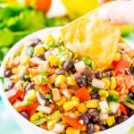 Cowboy Caviar is a Mexican-inspired dip or topping that’s loaded with beans, corn, onion, peppers, tomato, cilantro, and a handful of zesty spices! It’s the perfect addition to game day snacks, barbecues, taco night, and more!