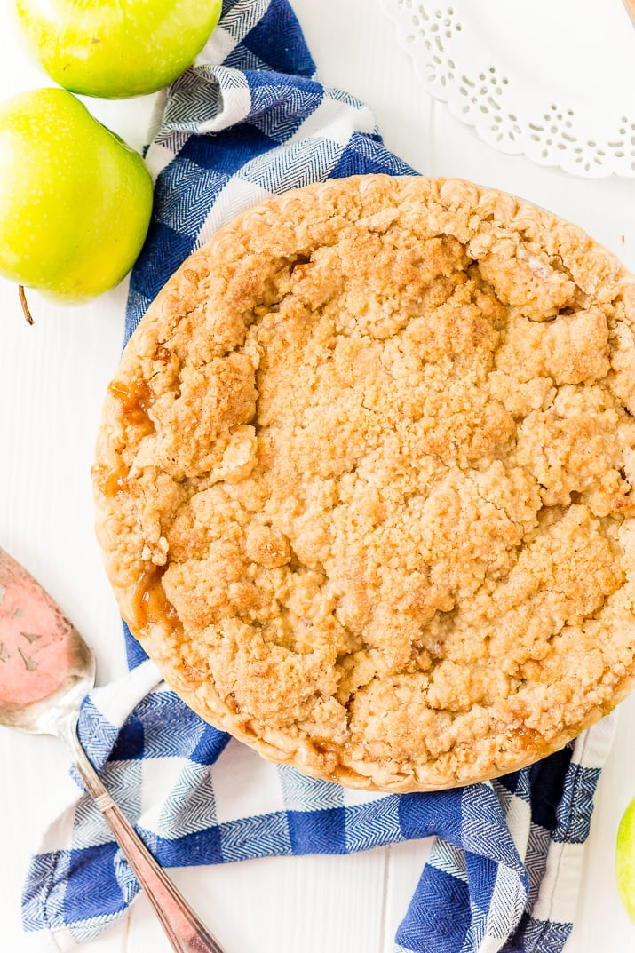 Overhead photo of a Dutch Apple Pie with a serving spatula next to it.