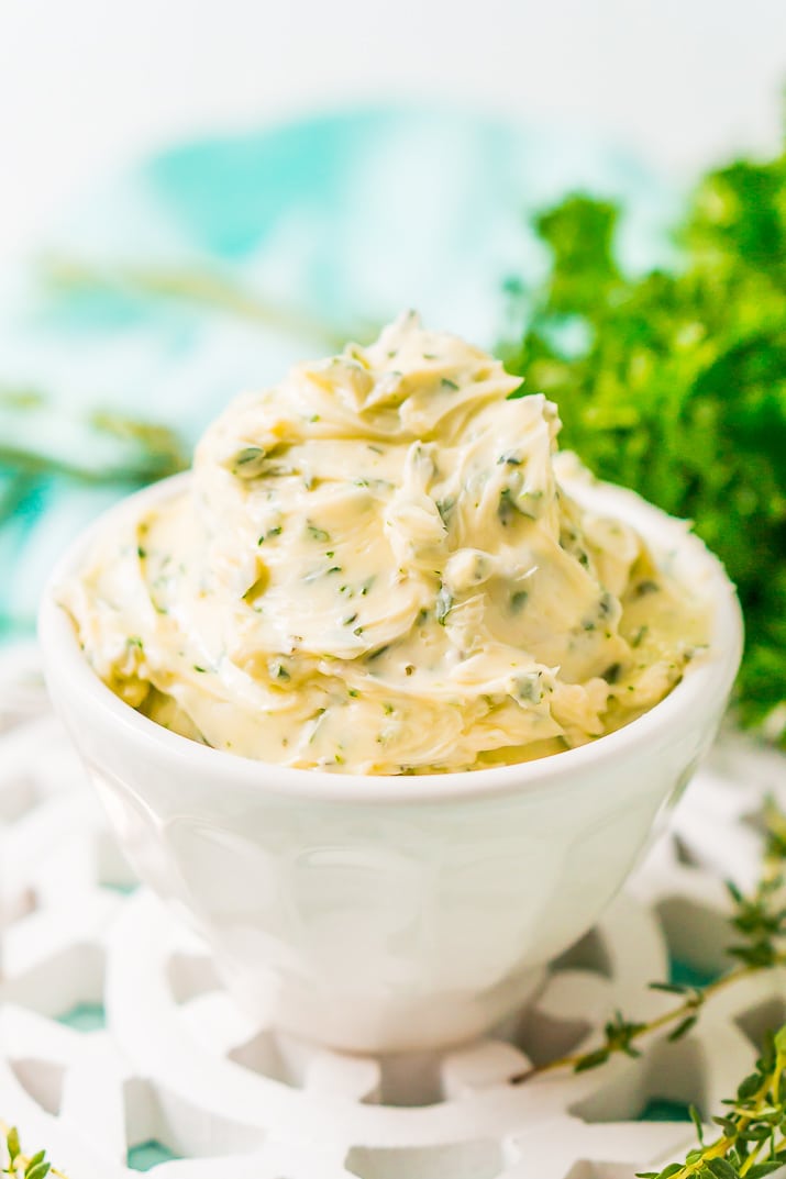 This savory Herb Butter is infused with parsley, thyme, rosemary, black pepper, and lemon zest for a flavorful spread that tastes delicious on garlic bread, dinner rolls, steak, and more!