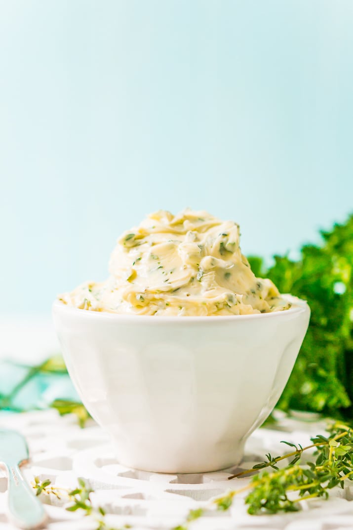 This savory Herb Butter is infused with parsley, thyme, rosemary, black pepper, and lemon zest for a flavorful spread that tastes delicious on garlic bread, dinner rolls, steak, and more!