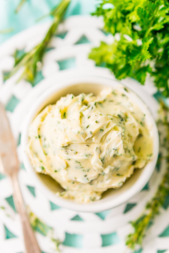 This savory Herb Butter is infused with parsley, thyme, rosemary, black pepper, and lemon zest for a flavorful spread that tastes delicious on garlic bread, dinner rolls, steak, and more!