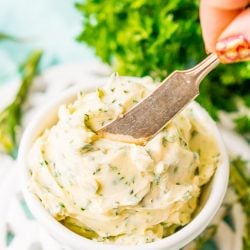 This savory Herb Butter is infused with parsley, thyme, rosemary, black pepper, and lemon zest for a flavorful spread that tastes delicious on garlic bread, dinner rolls, steak, and more!