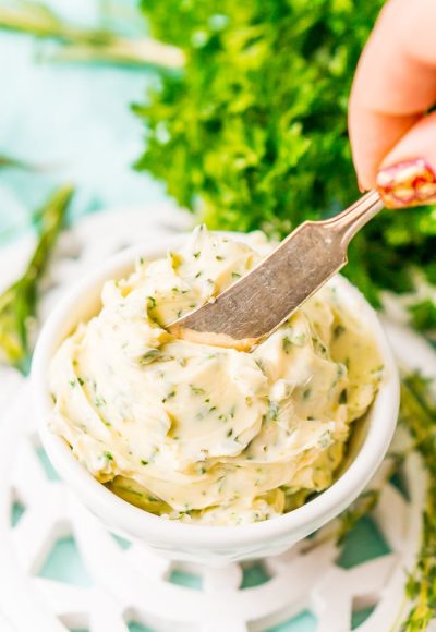 This savory Herb Butter is infused with parsley, thyme, rosemary, black pepper, and lemon zest for a flavorful spread that tastes delicious on garlic bread, dinner rolls, steak, and more!