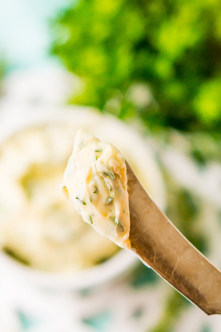 This savory Herb Butter is infused with parsley, thyme, rosemary, black pepper, and lemon zest for a flavorful spread that tastes delicious on garlic bread, dinner rolls, steak, and more!