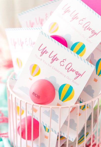 These Baby Shower Favors are a Free Printable perfect for any travel themed baby shower. These Party Favors were designed to fit EOS lip balms.