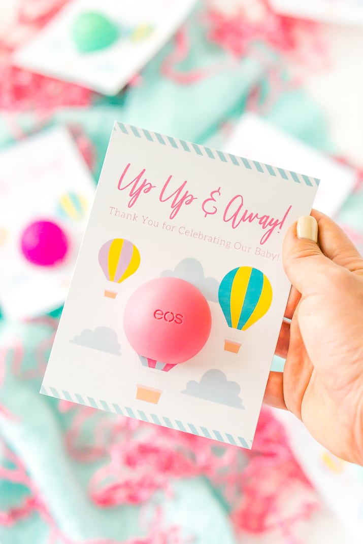 These Baby Shower Favors are a Free Printable perfect for any travel themed baby shower. These Party Favors were designed to fit EOS lip balms.