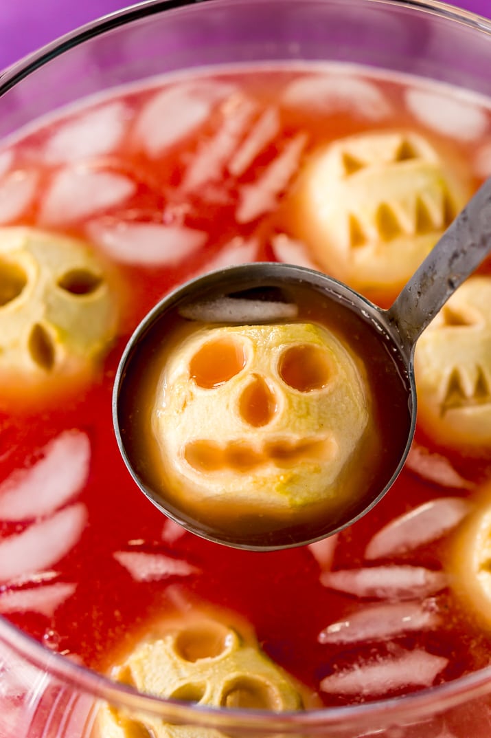 Shrunken Head Party Punch doubles as a delicious drink and a creepy conversation piece! Made with fruit juices, lemon-lime soda, and a splash of grenadine, the best part of this beverage is the floating “shrunken heads” which are made with baked apples!