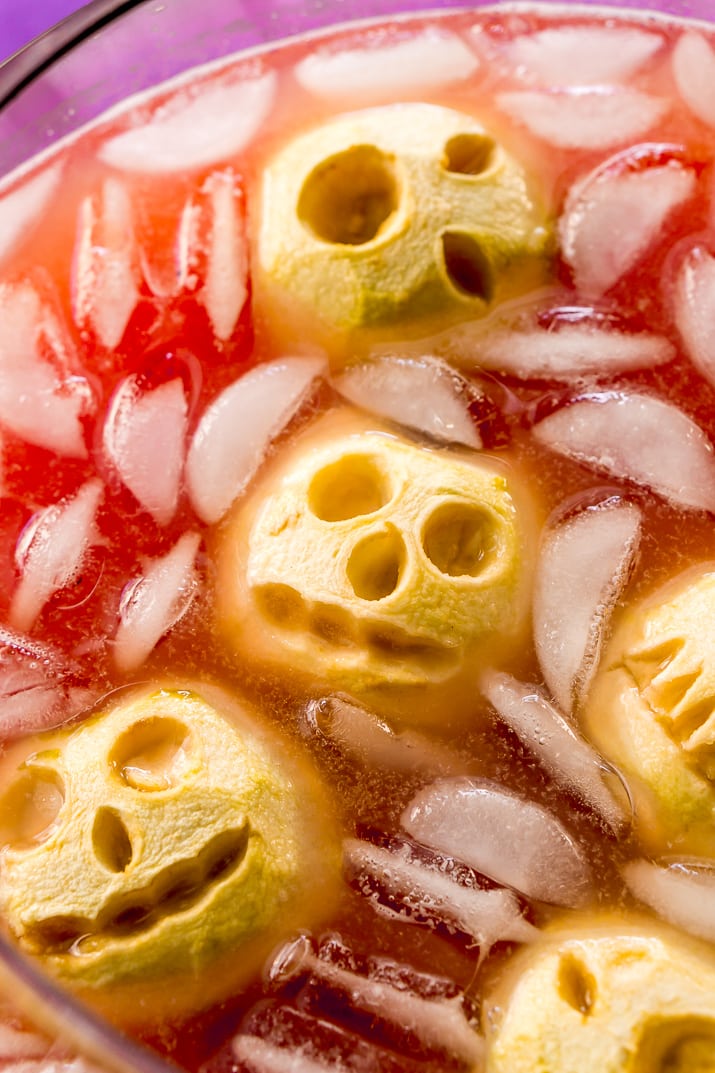 Shrunken Head Party Punch doubles as a delicious drink and a creepy conversation piece! Made with fruit juices, lemon-lime soda, and a splash of grenadine, the best part of this beverage is the floating “shrunken heads” which are made with baked apples!