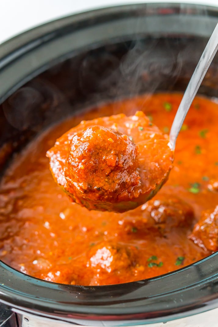 These Crockpot Meatballs are the ultimate slow-cooked dinner. Enjoy homemade Italian Meatballs in a rich tomato sauce, just add your favorite pasta or make subs!