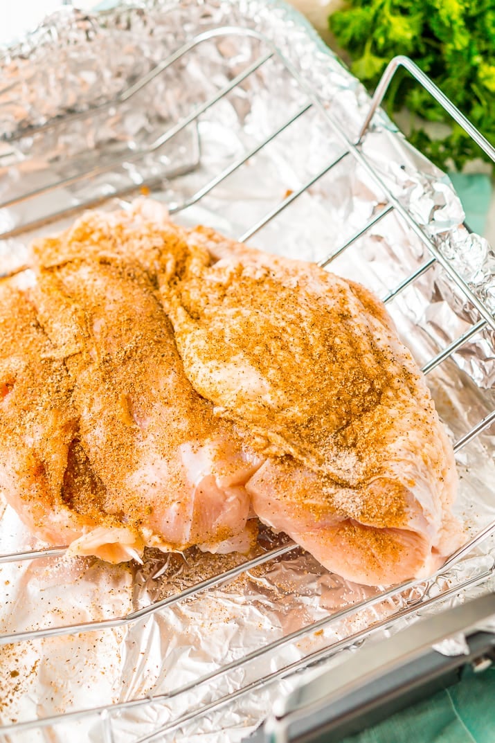 This Smoked Turkey Breast is made with a warm and spicy dry rub that adds tons of flavor to the tender and juicy meat.