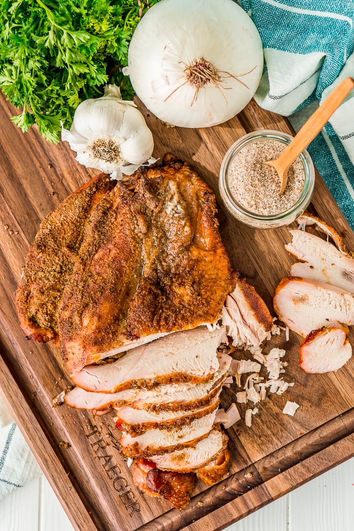 This Smoked Turkey Breast is made with a warm and spicy dry rub that adds tons of flavor to the tender and juicy meat.