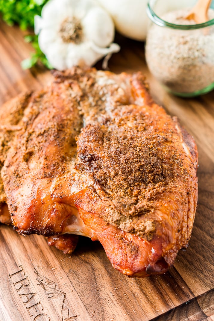 This Smoked Turkey Breast is made with a warm and spicy dry rub that adds tons of flavor to the tender and juicy meat.