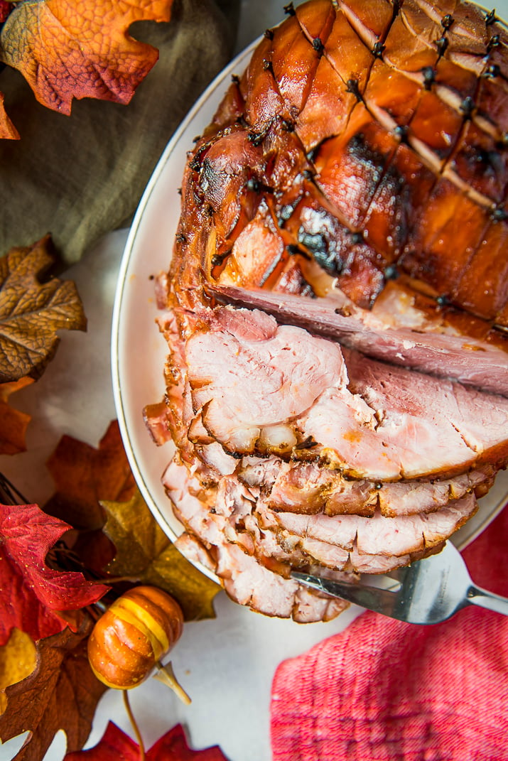 If you're looking for the most delicious holiday ham, then you need this Maple Ham Glaze recipe! It's so simple to throw together, and creates the prettiest ham imaginable!