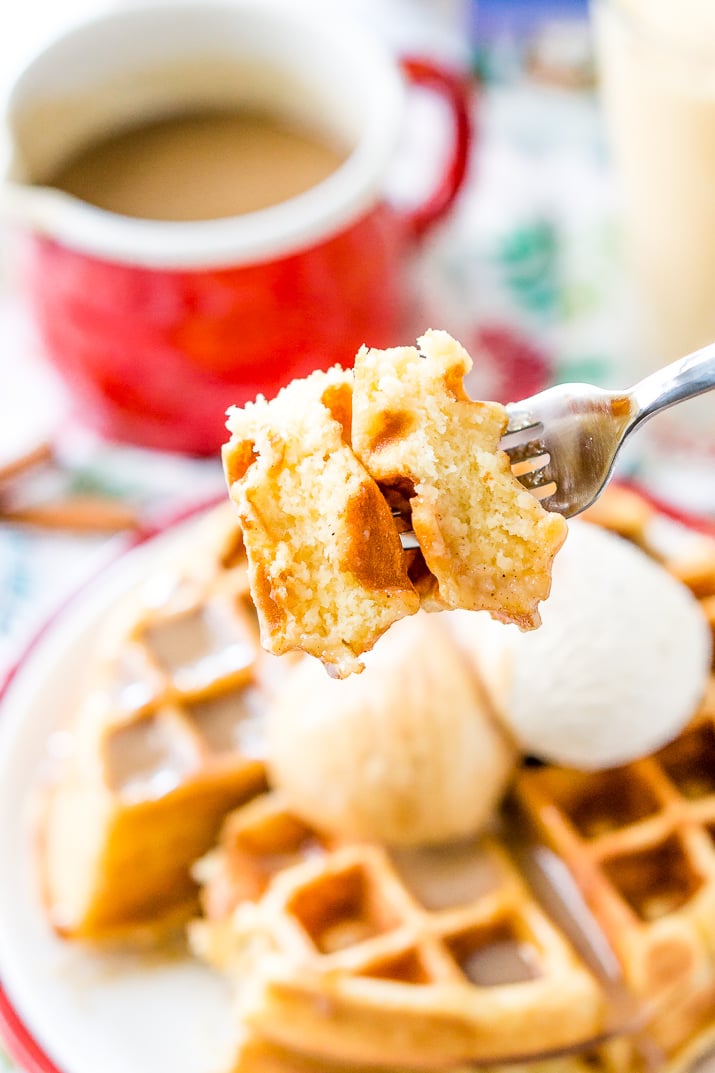 Eggnog Waffles are crisp and golden on the outside and fluffy on the inside, topped with whipped cream and spiced vanilla syrup!