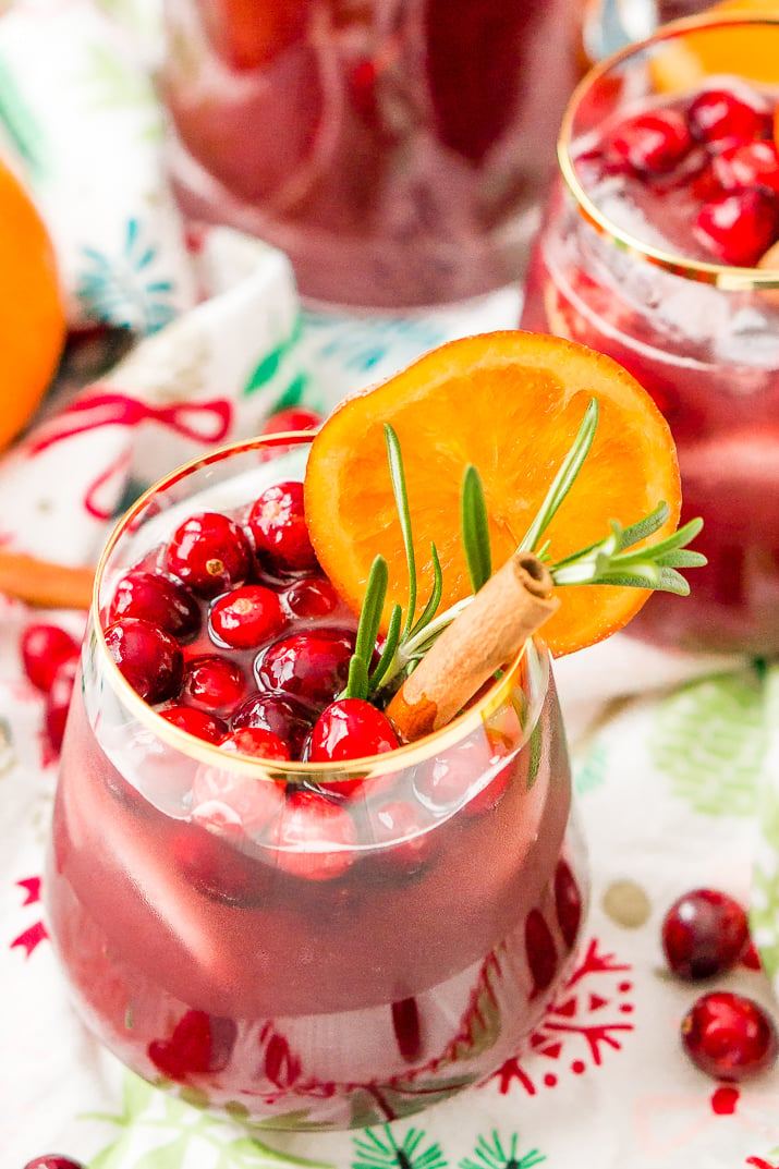 This Christmas Sangria is made with red wine, fruit juices, brandy, soda, and fruit for a delicious big-batch cocktail that's perfect for parties.