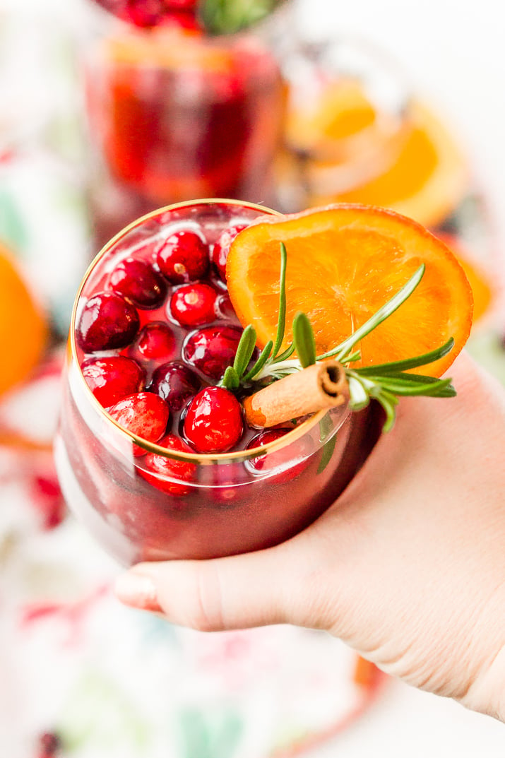 This Christmas Sangria is made with red wine, fruit juices, brandy, soda, and fruit for a delicious big-batch cocktail that's perfect for parties.