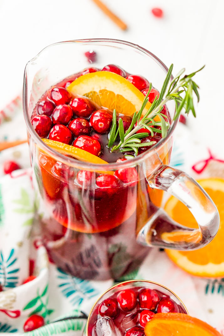 This Christmas Sangria is made with red wine, fruit juices, brandy, soda, and fruit for a delicious big-batch cocktail that's perfect for parties.