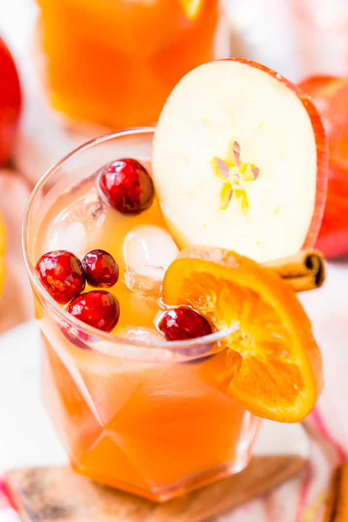 This Thanksgiving Punch made with apple cider, whiskey, fruit juice, brandy, and soda packs the delicious flavors of fall and winter in one delicious holiday drink recipe!