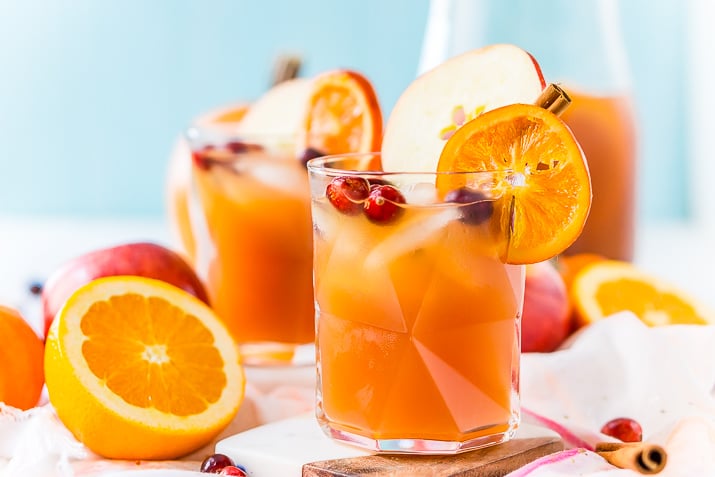 This Thanksgiving Punch made with apple cider, whiskey, fruit juice, brandy, and soda packs the delicious flavors of fall and winter in one delicious holiday drink recipe!