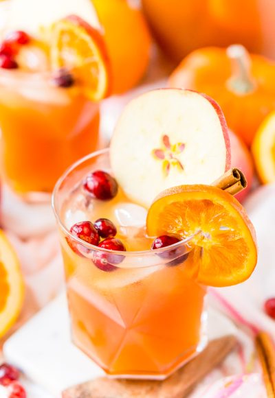 This Thanksgiving Punch made with apple cider, whiskey, fruit juice, brandy, and soda packs the delicious flavors of fall and winter in one delicious holiday drink recipe!