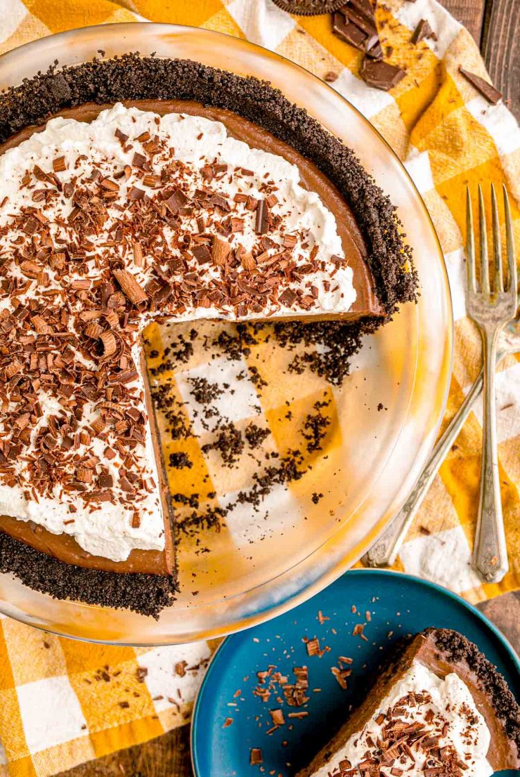 Overhead photo of a chocolate cream pie with slices missing from the pan.