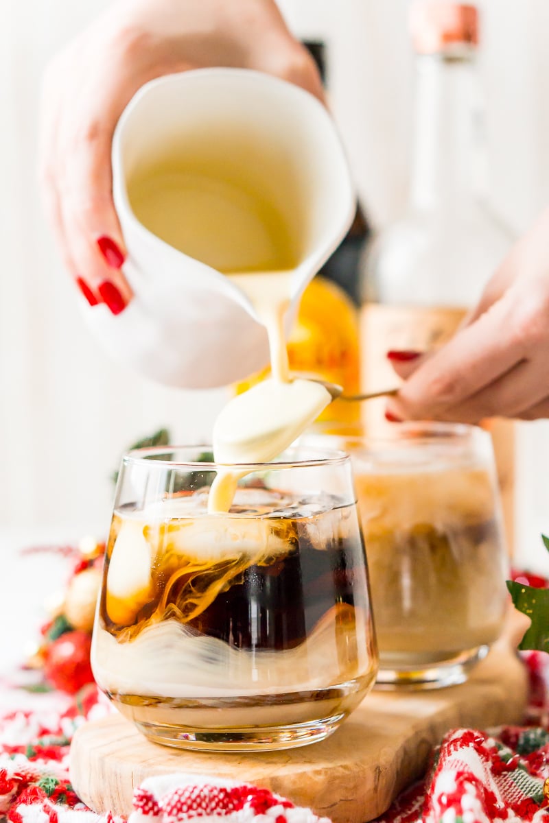 This Eggnog White Russian is a fun holiday twist on the classic vodka cocktail! Made with eggnog, coffee liqueur, vodka, and a dash of nutmeg!