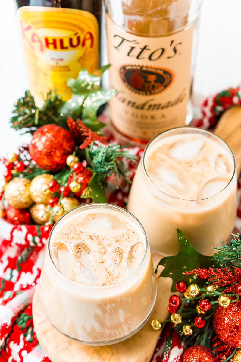 This Eggnog White Russian is a fun holiday twist on the classic vodka cocktail! Made with eggnog, coffee liqueur, vodka, and a dash of nutmeg!