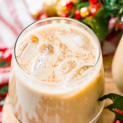 This Eggnog White Russian is a fun holiday twist on the classic vodka cocktail! Made with eggnog, coffee liqueur, vodka, and a dash of nutmeg!