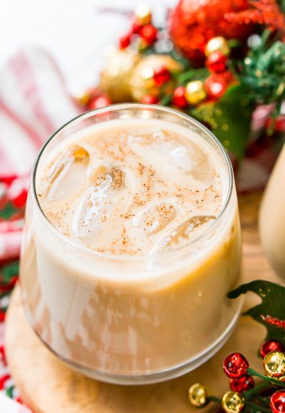 This Eggnog White Russian is a fun holiday twist on the classic vodka cocktail! Made with eggnog, coffee liqueur, vodka, and a dash of nutmeg!