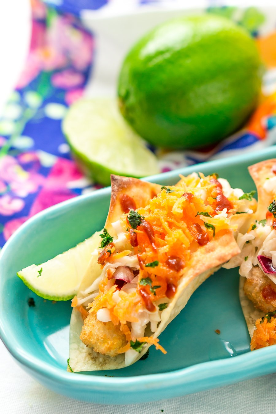 These Fish Sticks Wonton Tacos are an easy appetizer recipe perfect for get-togethers. Each mini taco is made with Crunchy Breaded Fish Sticks, crunchy slaw, and an Asian-inspired sauce.