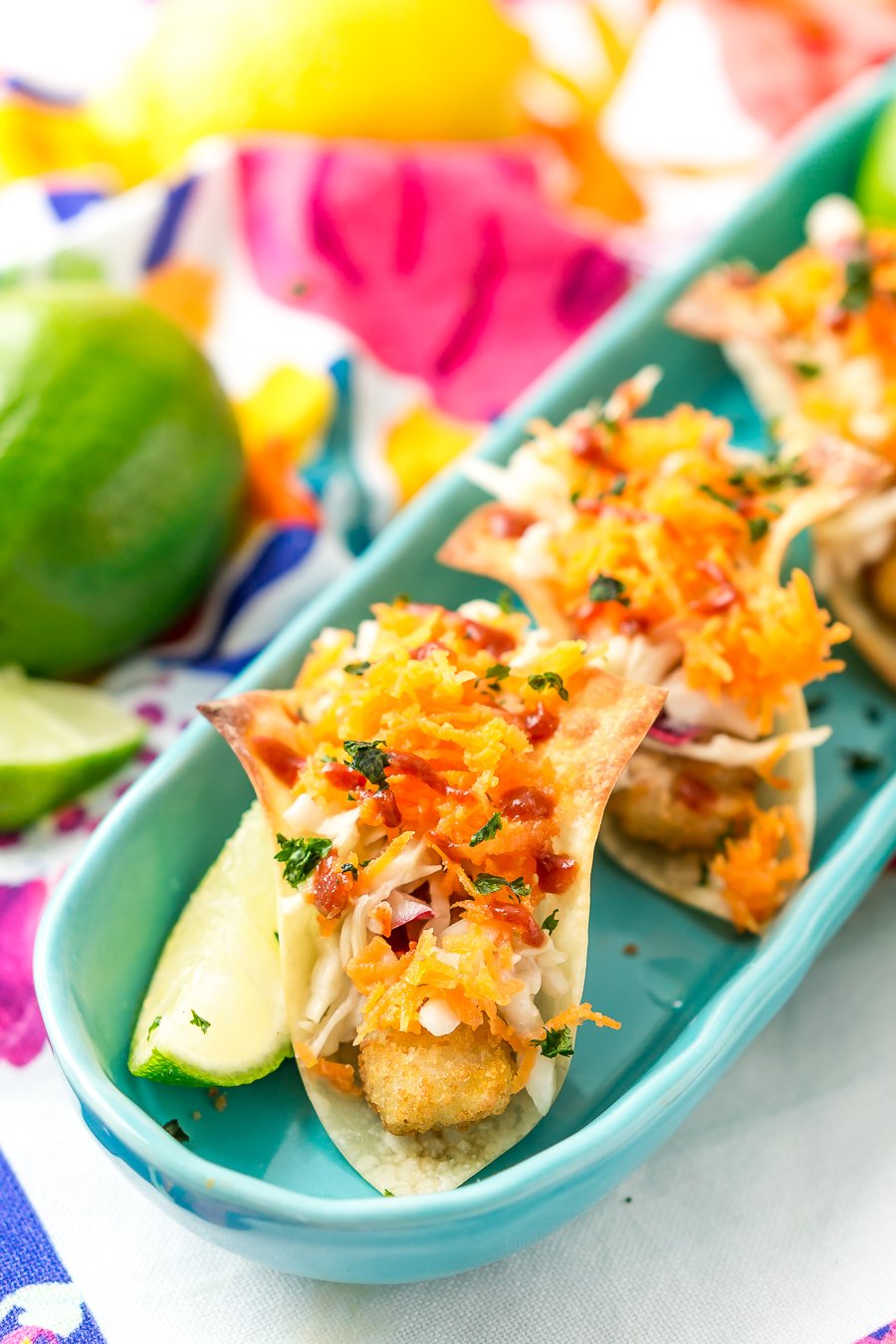 These Fish Sticks Wonton Tacos are an easy appetizer recipe perfect for get-togethers. Each mini taco is made with Crunchy Breaded Fish Sticks, crunchy slaw, and an Asian-inspired sauce.