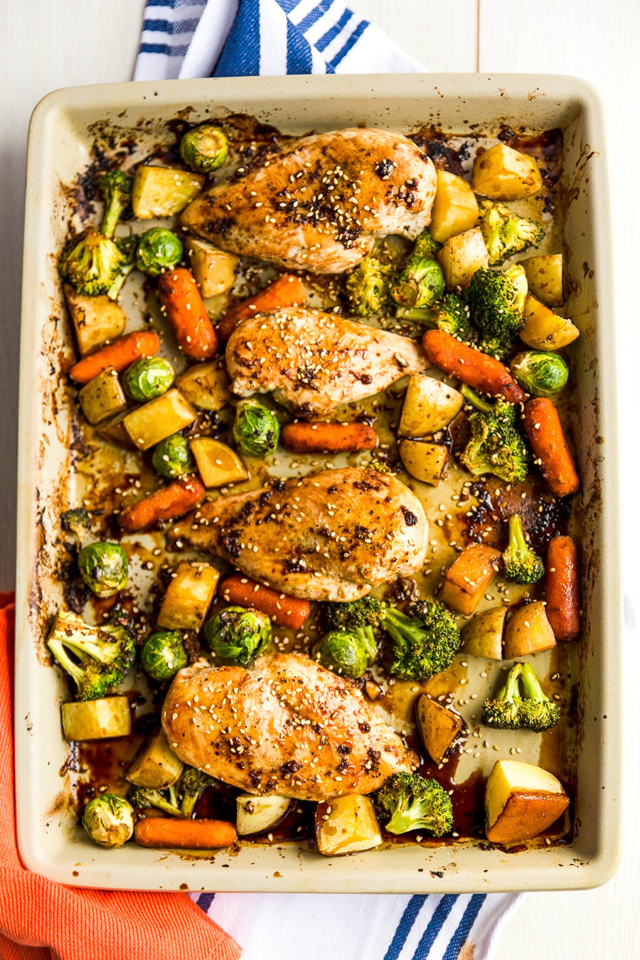 This Honey Ginger Chicken Sheet Pan Dinner is an easy Asian-inspired dish made with a tangy homemade sauce. You only need one pan to make it, so cleanup is a breeze!