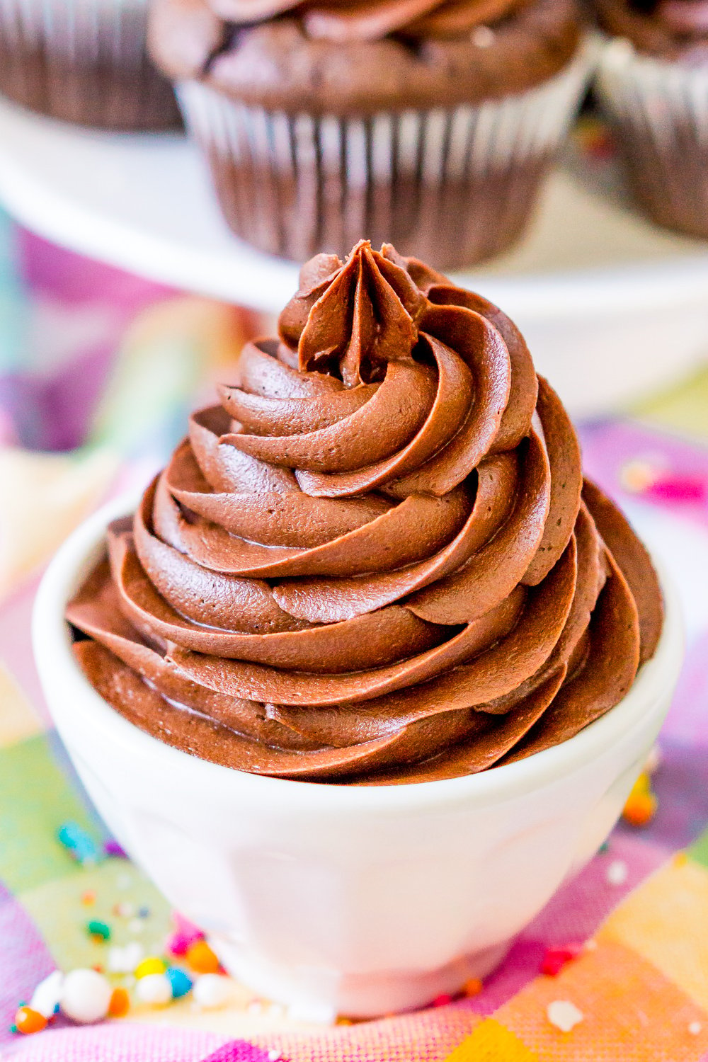 The BEST Chocolate Buttercream Frosting recipe made with chocolate liqueur and whipped to perfection. It's a must for topping cakes and cupcakes or simply licking from the bowl.